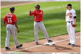 Coach and Two Players Talking to Each Other