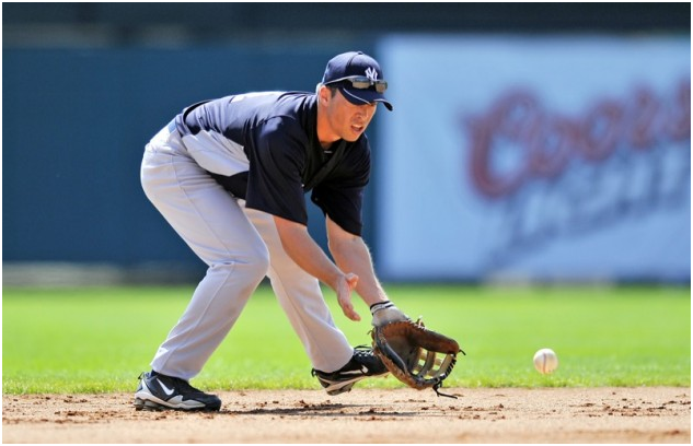 Baseball Player Catching a Ground Ball